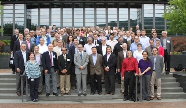 Photo of researchers on stairs in front of Corning Glass´s building.